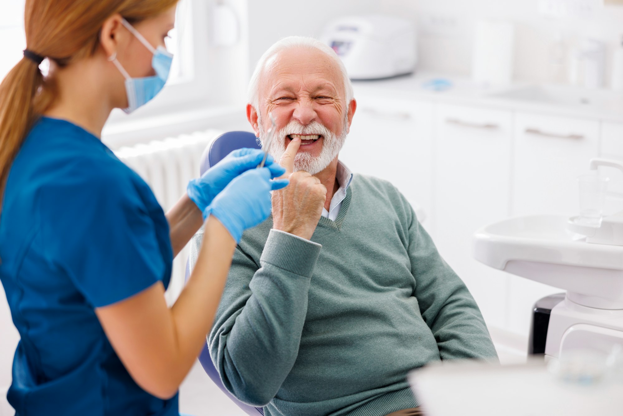 Dentist checking up patient